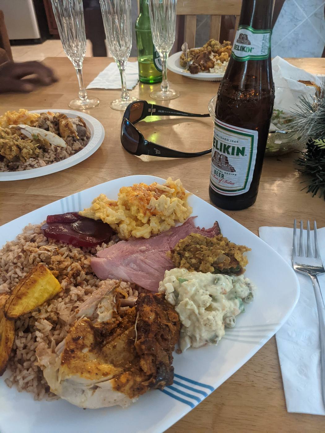 Gourmet Belizean meal beautifully plated with Belikin beer